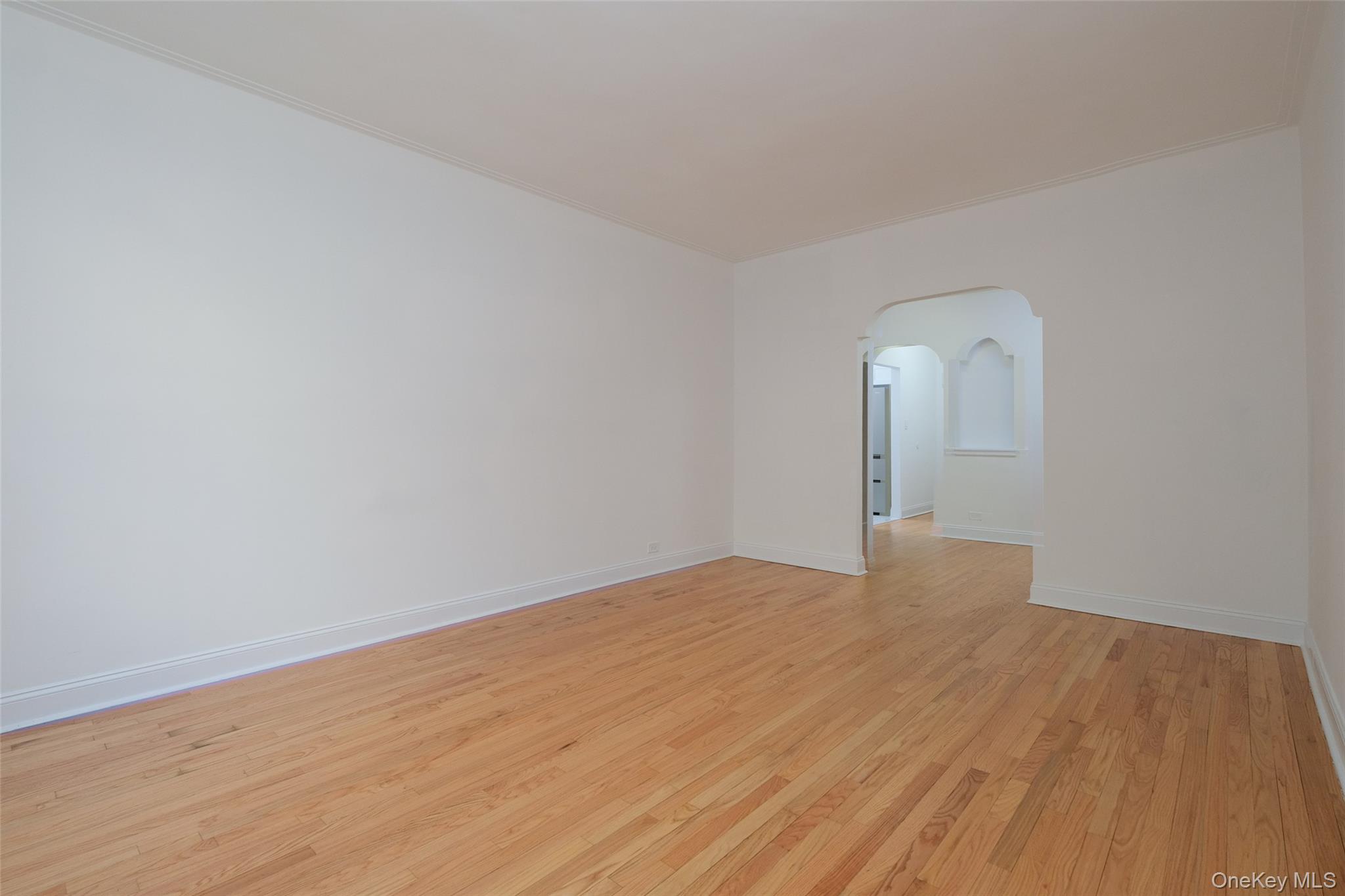 340 East Mosholu Parkway South, Unit 1A Bronx, NY 10458 - Photo 4 of 10 a view of empty room with wooden floor