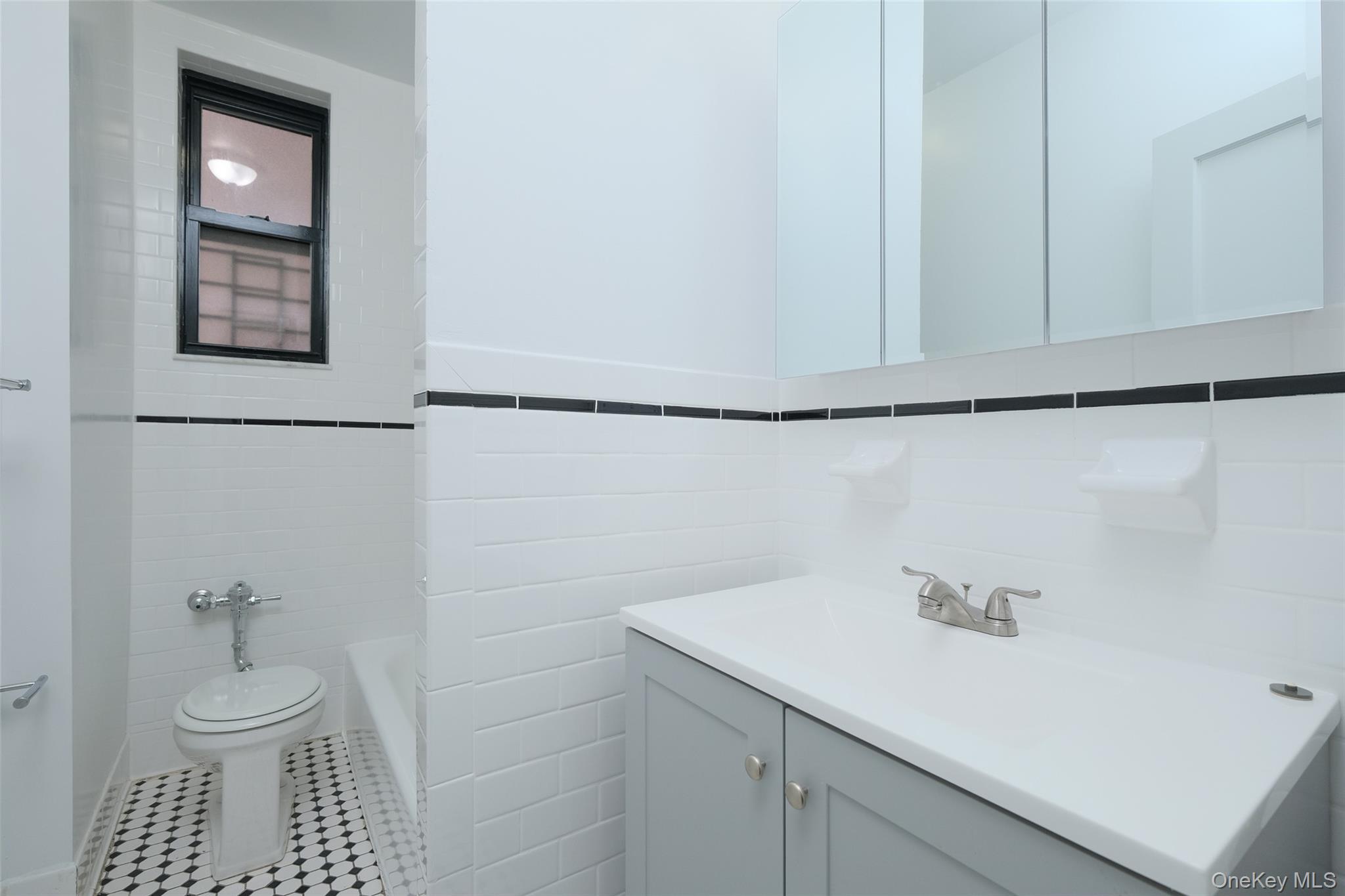 340 East Mosholu Parkway South, Unit 1A Bronx, NY 10458 - Photo 8 of 10 a bathroom with a sink and a mirror