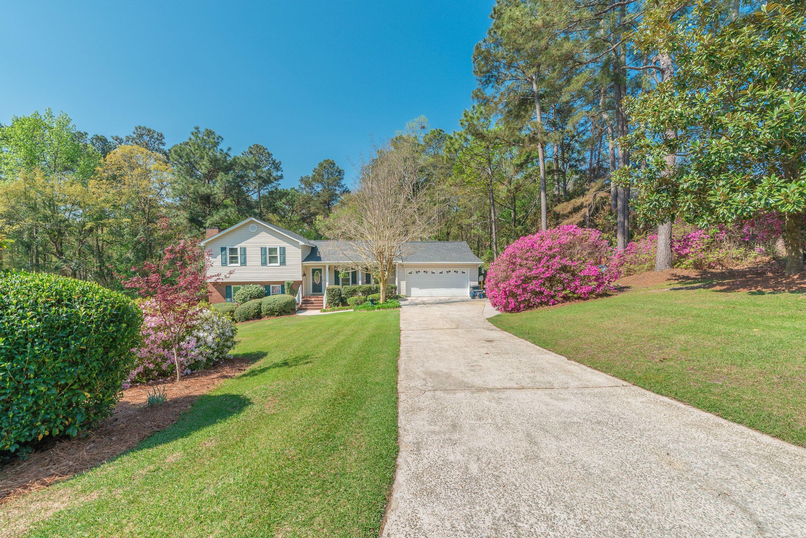 1117 Ridgemont Drive Aiken, SC 29803 - Photo 44 of 49 a front view of a house with garden
