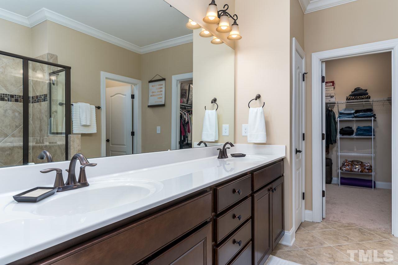 1524 Catch Fly Lane Durham, NC 27713 - Photo 19 of 25 a bathroom with a sink double vanity and a mirror