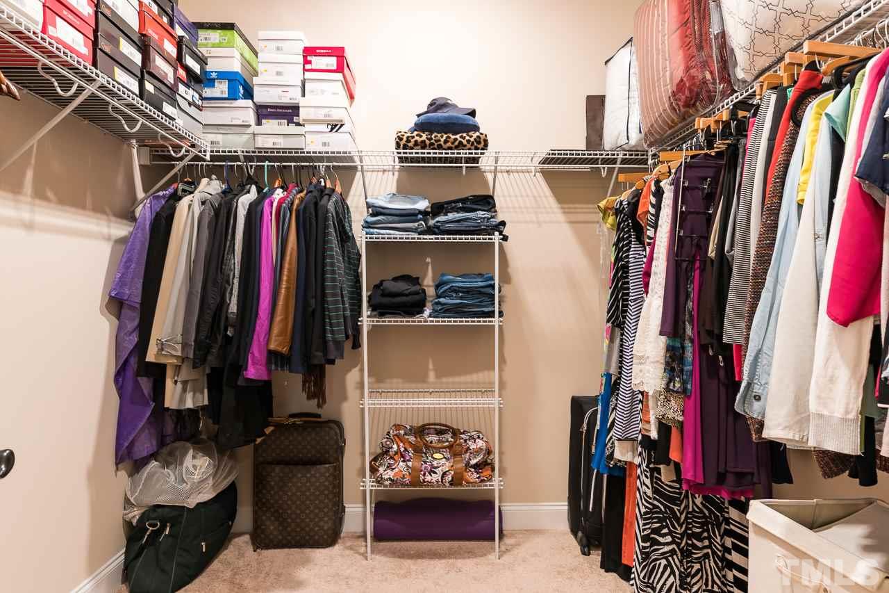 1524 Catch Fly Lane Durham, NC 27713 - Photo 20 of 25 a view of walk in closet with clothes and shoes