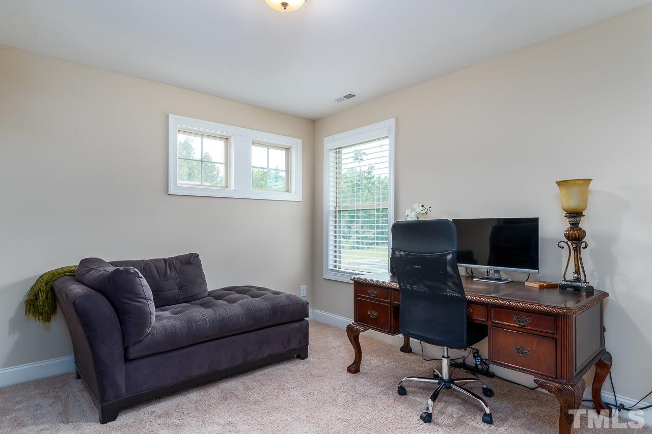1524 Catch Fly Lane Durham, NC 27713 - Photo 22 of 25 a livingroom with workspace and a couch