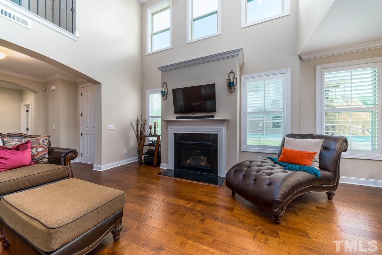 1524 Catch Fly Lane Durham, NC 27713 - Photo 6 of 25 a bedroom with furniture and a fireplace