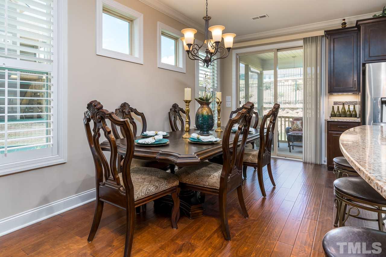1524 Catch Fly Lane Durham, NC 27713 - Photo 9 of 25 a view of a dining room with furniture window and wooden floor