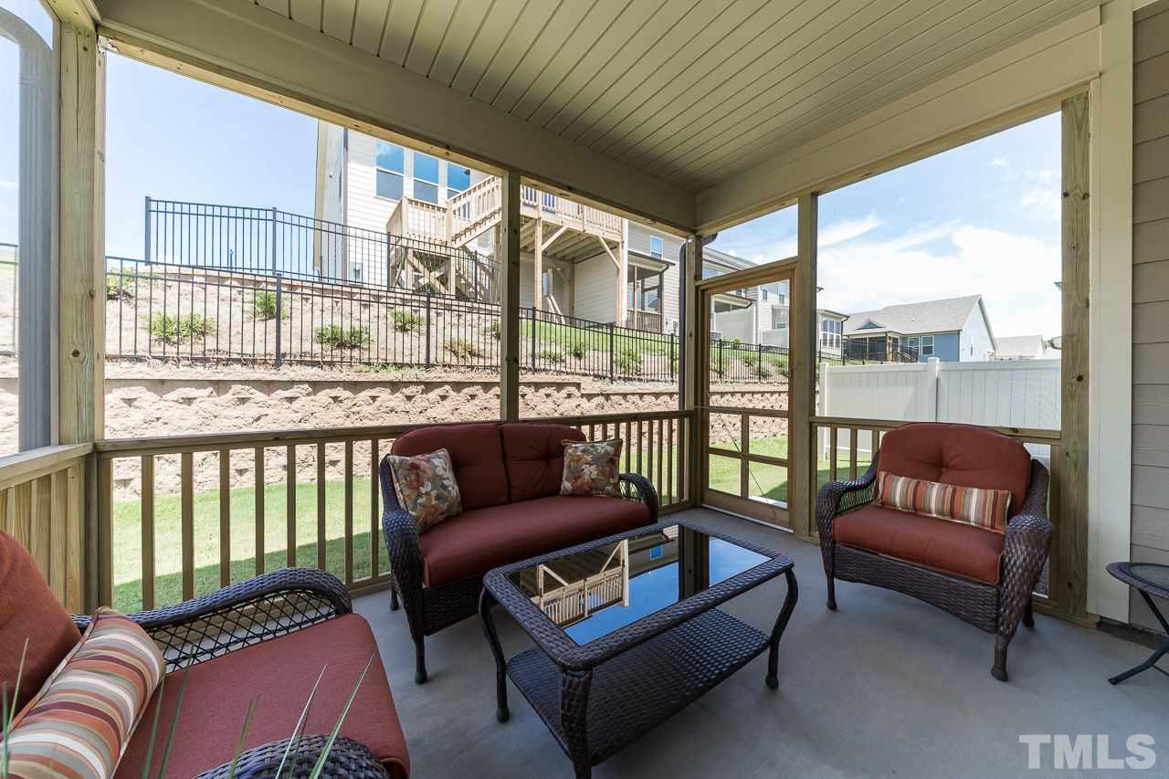 1524 Catch Fly Lane Durham, NC 27713 - Photo 10 of 25 a balcony with furniture and a potted plant
