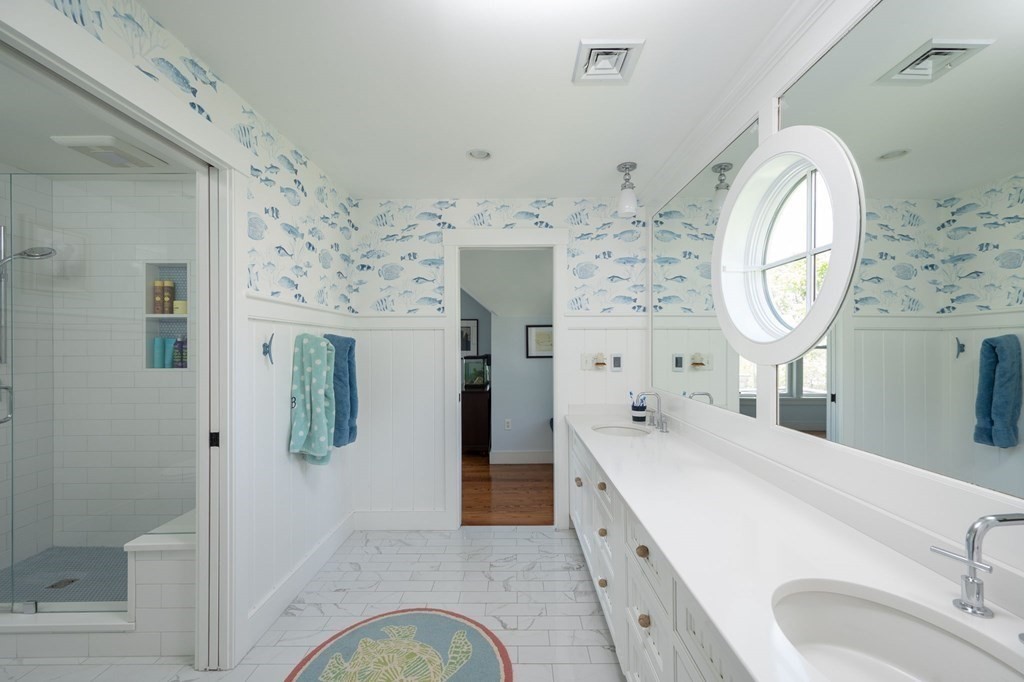 13 Martins Cove Road Hingham, MA 02043 - Photo 13 of 35 a spacious bathroom with a double vanity sink and a mirror