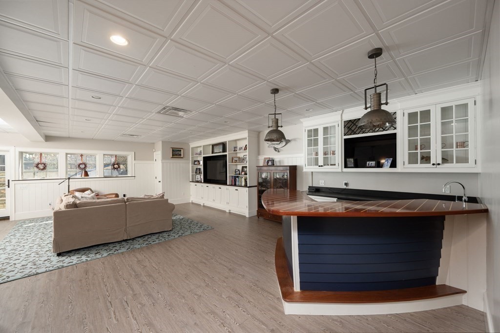 13 Martins Cove Road Hingham, MA 02043 - Photo 18 of 35 a kitchen with stainless steel appliances granite countertop a stove and a wooden floors