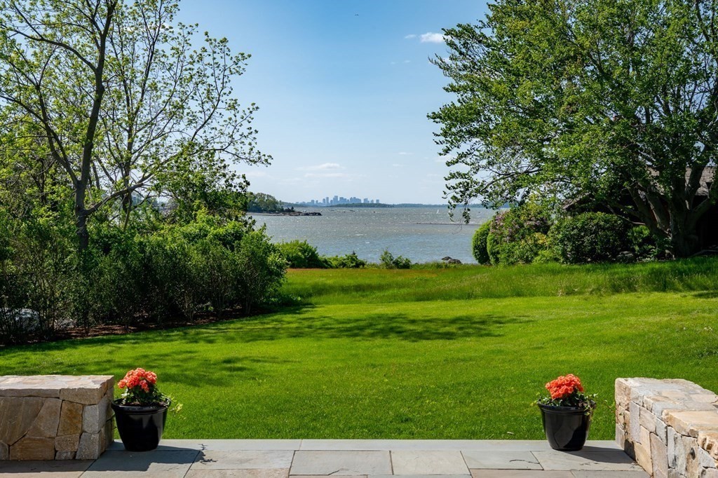 13 Martins Cove Road Hingham, MA 02043 - Photo 20 of 35 a view of a wooden deck and a garden