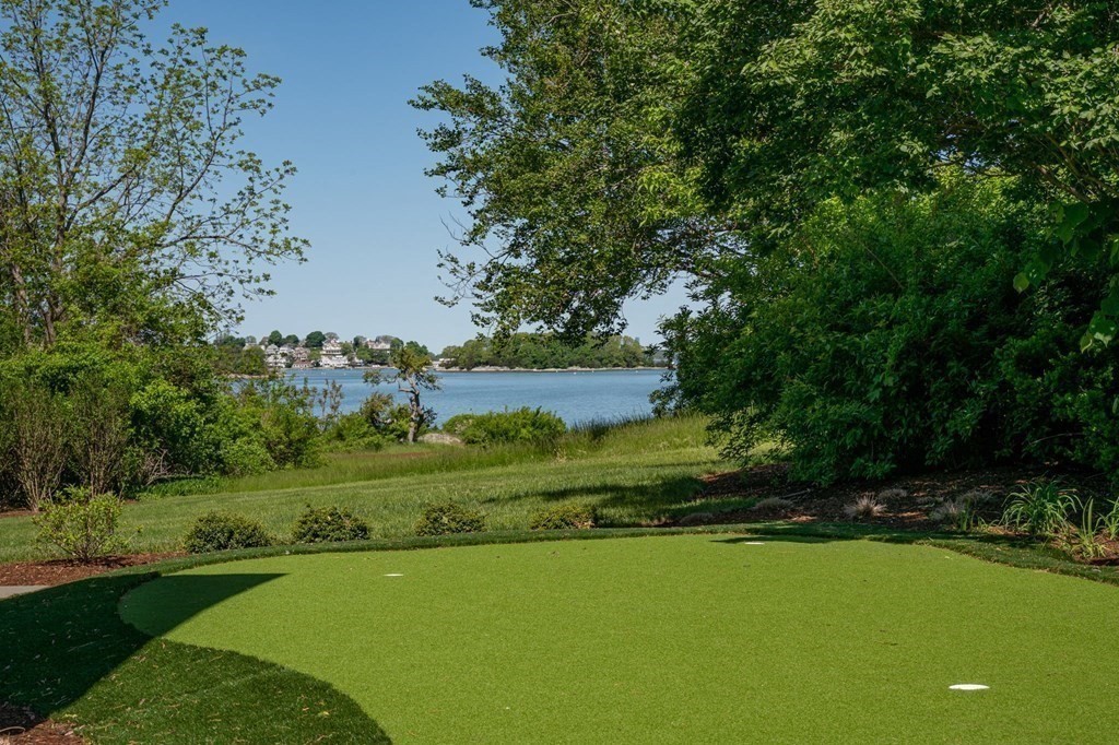 13 Martins Cove Road Hingham, MA 02043 - Photo 26 of 35 a view of a grassy field with trees