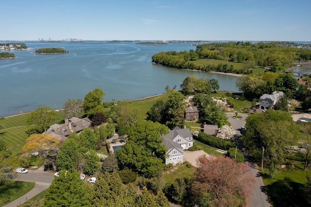 13 Martins Cove Road Hingham, MA 02043 - Photo 28 of 35 a view of a lake with lawn chairs