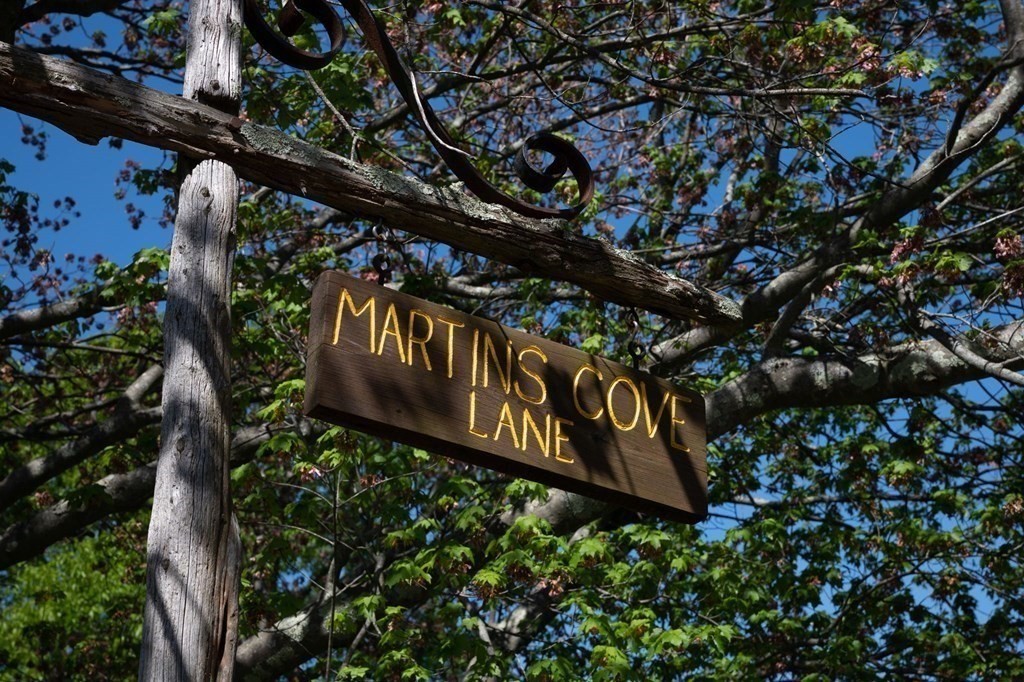 13 Martins Cove Road Hingham, MA 02043 - Photo 30 of 35 a street sign that is on a tree