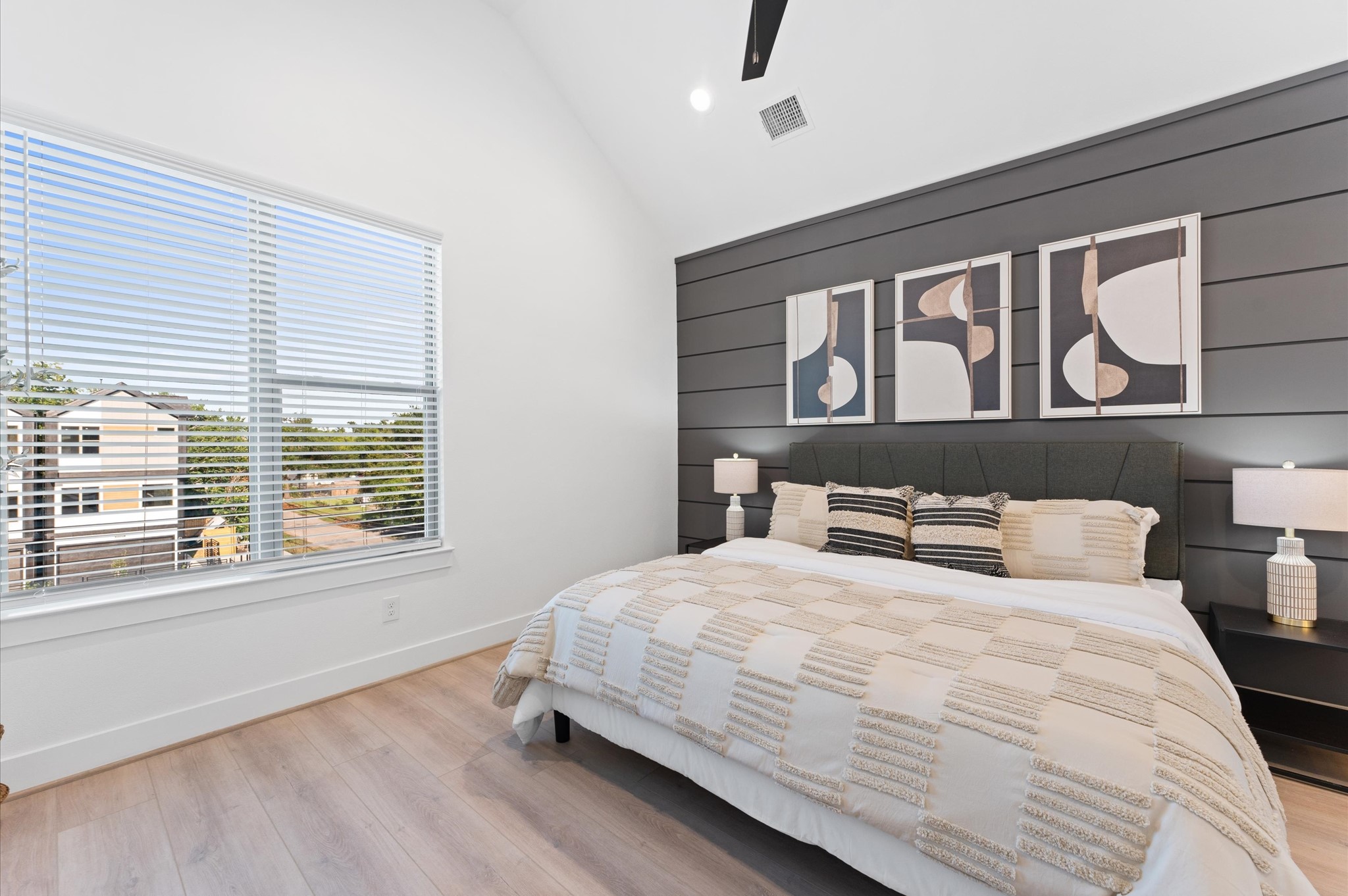 7803 Amelia Road, Unit B Houston, TX 77055 - Photo 25 of 30 a bedroom with a bed and a night stand