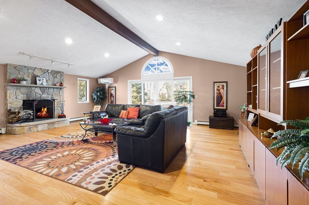 6 Richard Road Wayland, MA 01778 - Photo 4 of 36 a living room with furniture and a flat screen tv