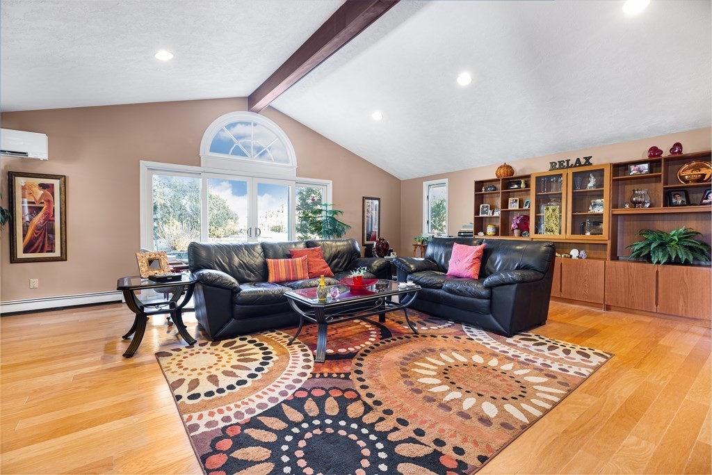 6 Richard Road Wayland, MA 01778 - Photo 6 of 36 a living room with furniture potted plant and a large window