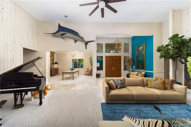 a kitchen with granite countertop a stove a sink and a refrigerator