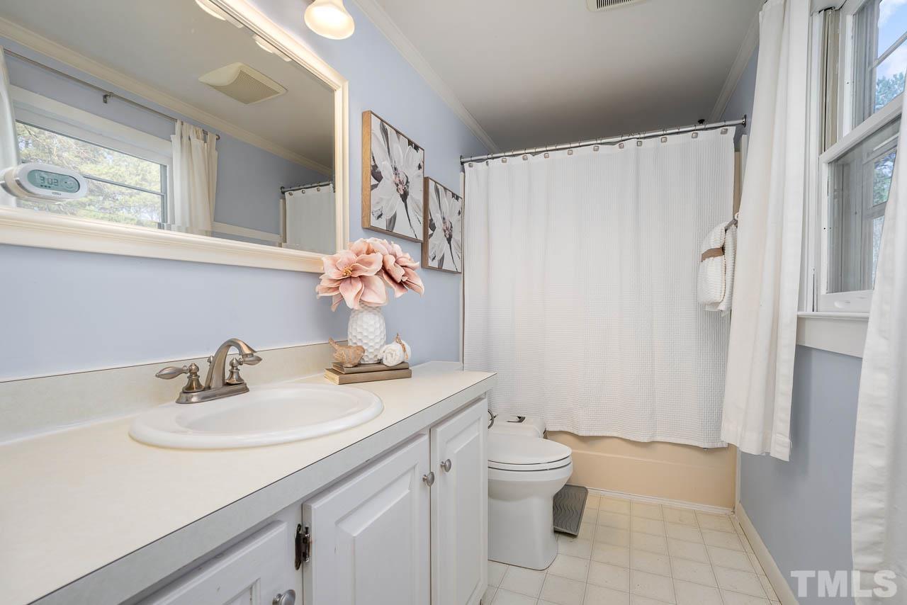 119 Community House Road Henderson, NC 27537 - Photo 7 of 10 a bathroom with a sink toilet and shower