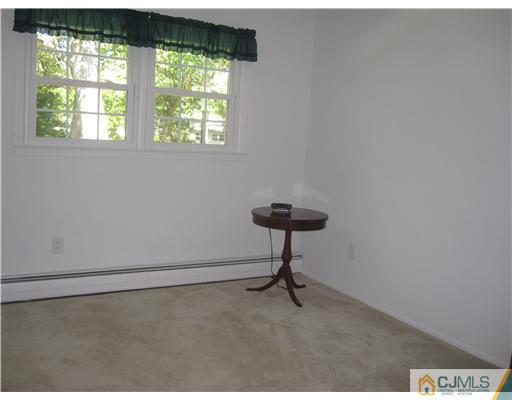8 Woodruff Road Edison, NJ 08820 - Photo 14 of 21 a view of a room with a window and a ceiling fan