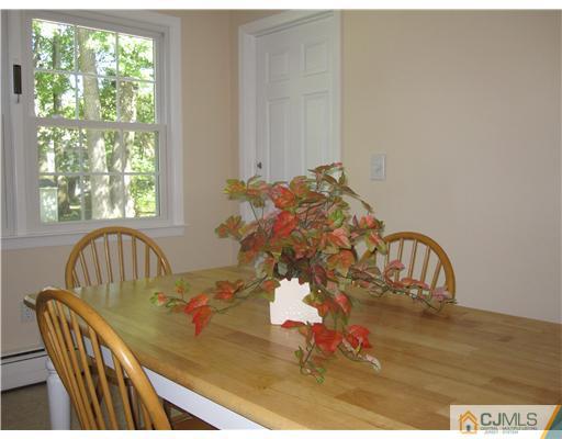 8 Woodruff Road Edison, NJ 08820 - Photo 3 of 21 a view of a dining room with furniture window and outside view