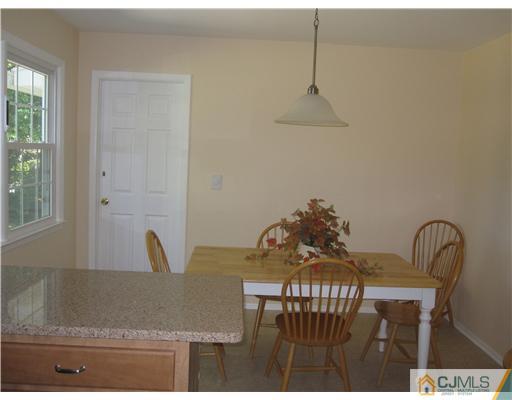 8 Woodruff Road Edison, NJ 08820 - Photo 4 of 21 a view of a dining room with furniture and window