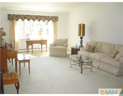 8 Woodruff Road Edison, NJ 08820 - Photo 5 of 21 a living room with furniture and a large window