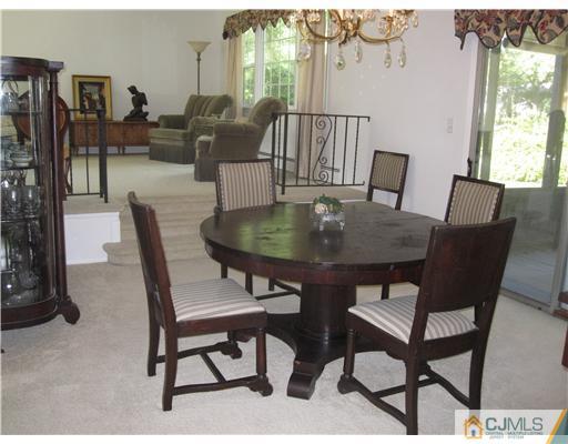 8 Woodruff Road Edison, NJ 08820 - Photo 7 of 21 a view of a dining room with furniture