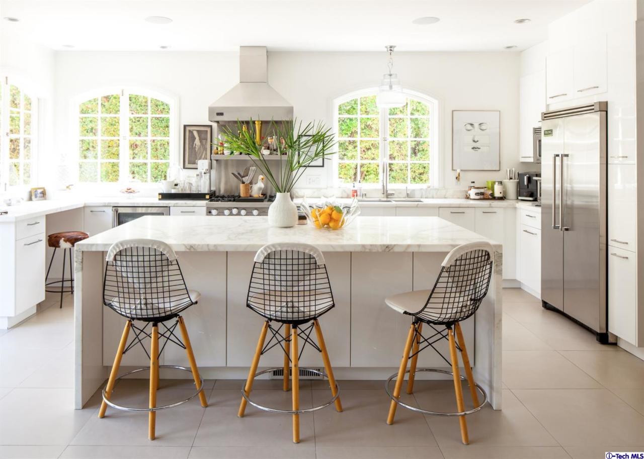 1665 Braeburn Road Altadena, CA 91001 - Photo 8 of 28 a dining room with furniture a chandelier and wooden floor