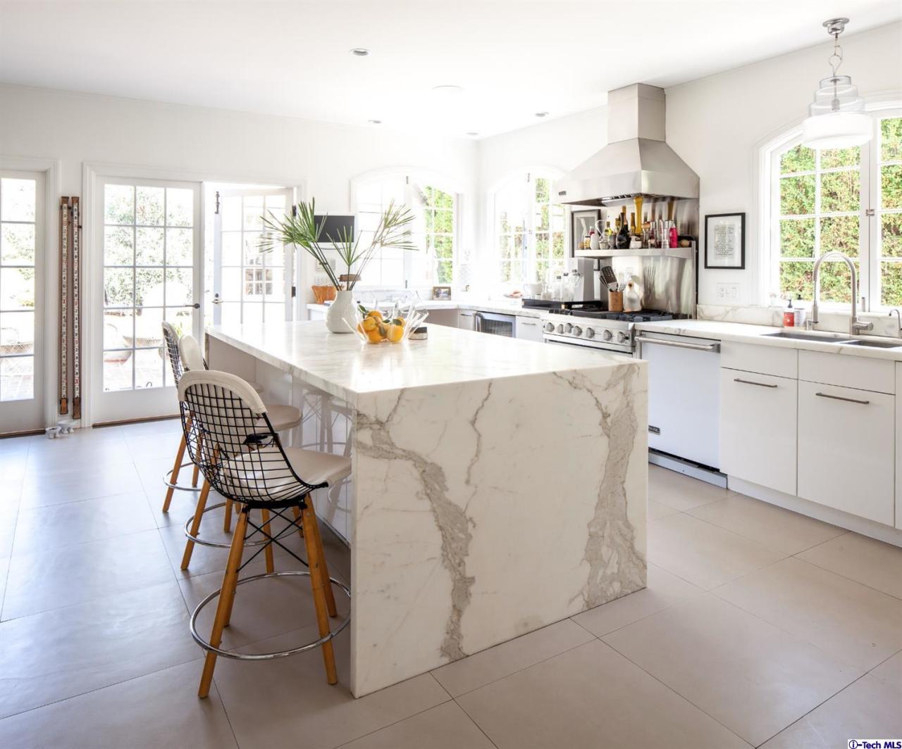1665 Braeburn Road Altadena, CA 91001 - Photo 9 of 28 a kitchen with stainless steel appliances a table and chairs in it