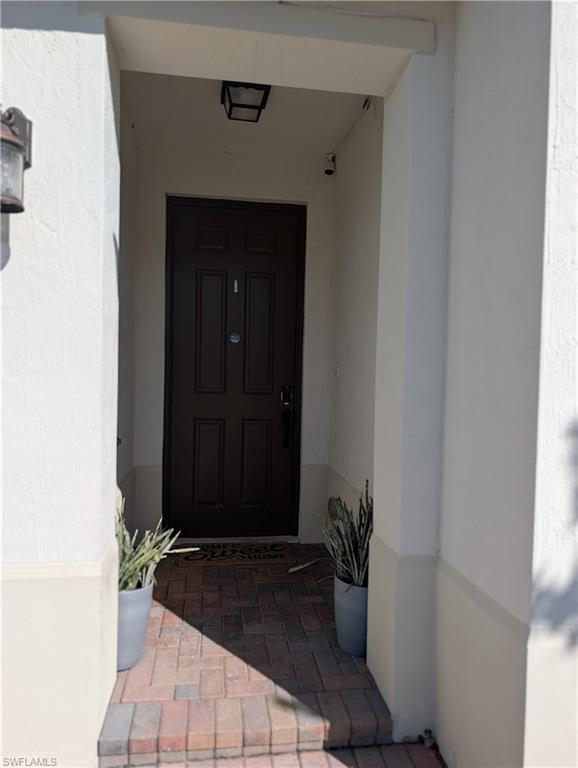 5518 Useppa Drive Ave Maria, FL 34142 - Photo 3 of 9 a view of entryway with a flower pot