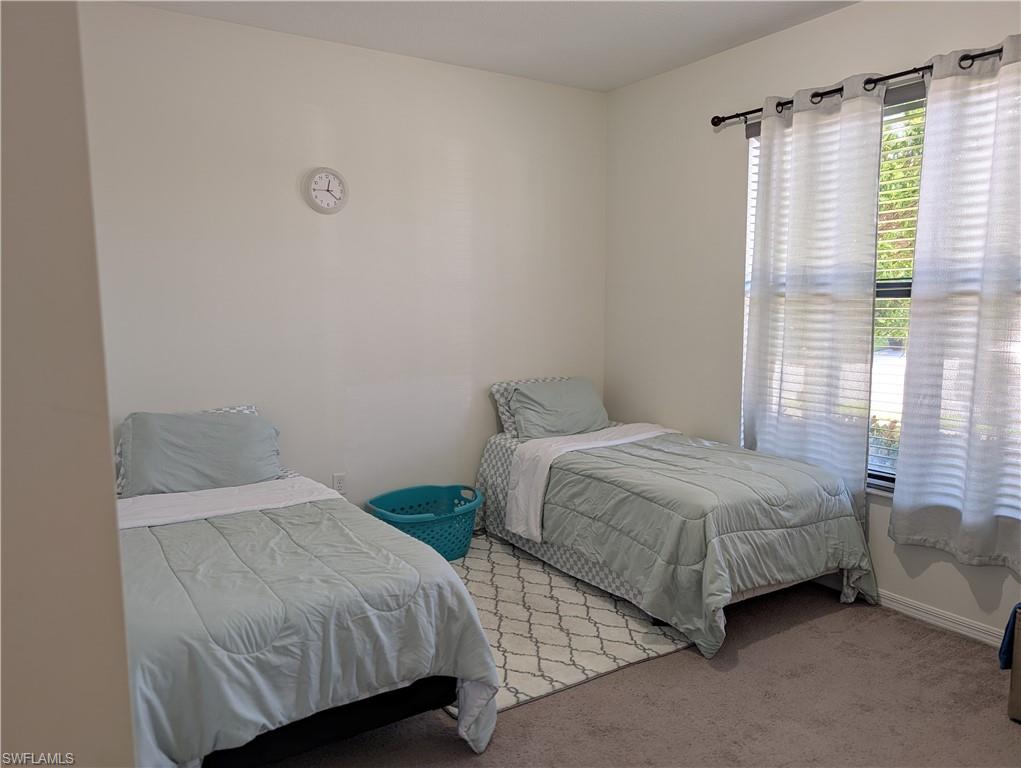 5518 Useppa Drive Ave Maria, FL 34142 - Photo 9 of 9 a bedroom with two beds and a window