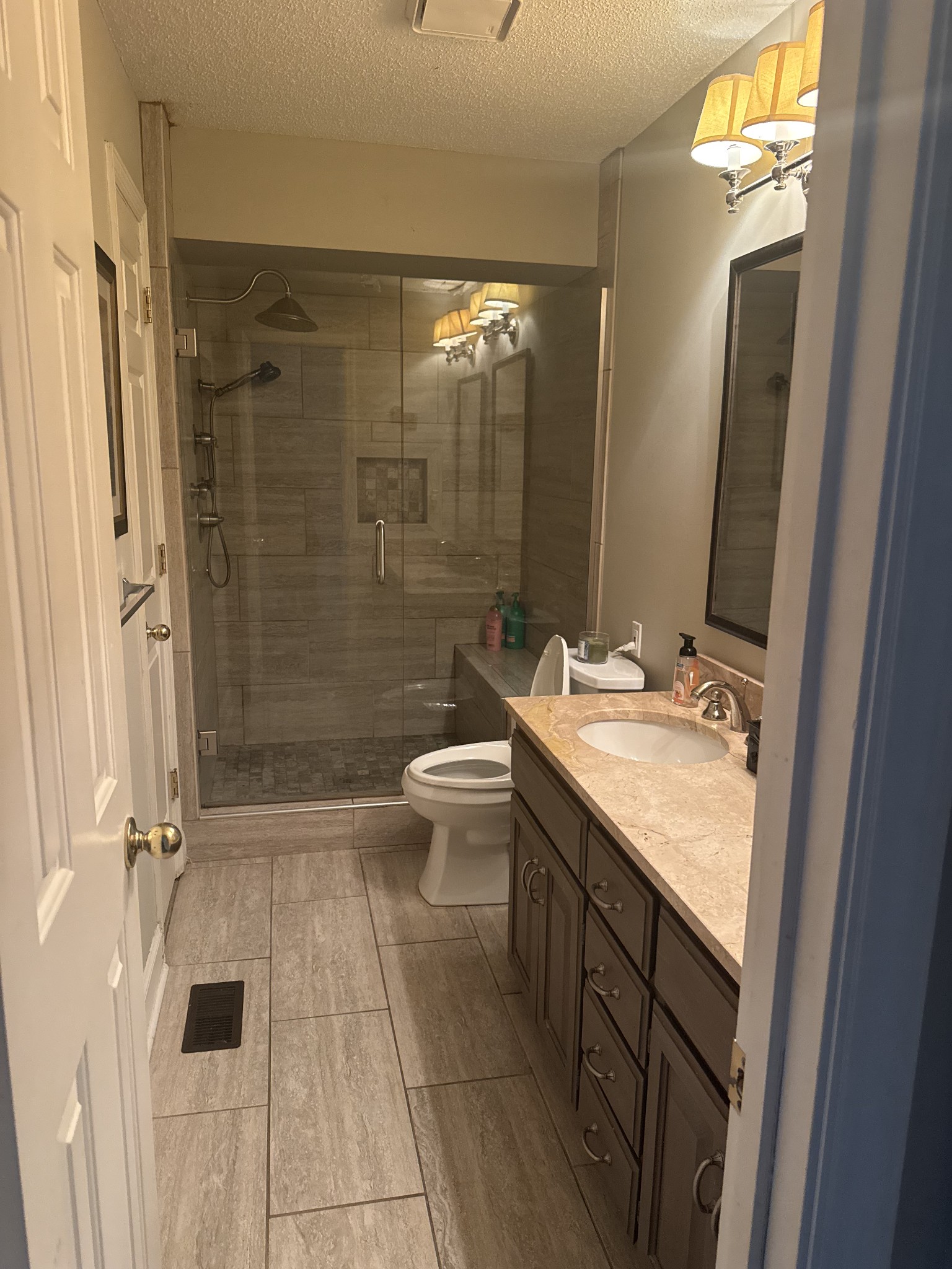 1304 Sycamore Valley Road Ashland City, TN 37015 - Photo 18 of 19 a bathroom with a double vanity sink toilet and shower