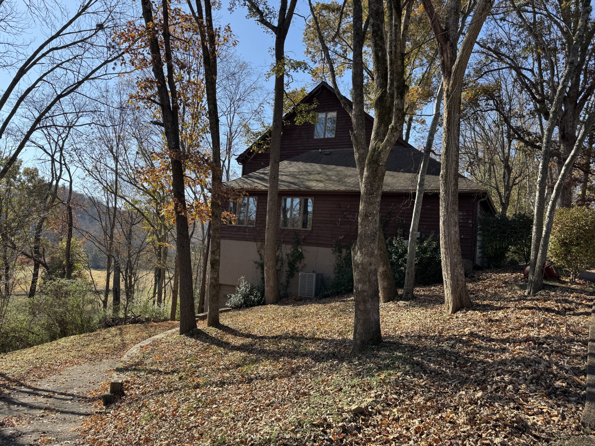 1304 Sycamore Valley Road Ashland City, TN 37015 - Photo 2 of 19 a view of a house with trees beside of the road