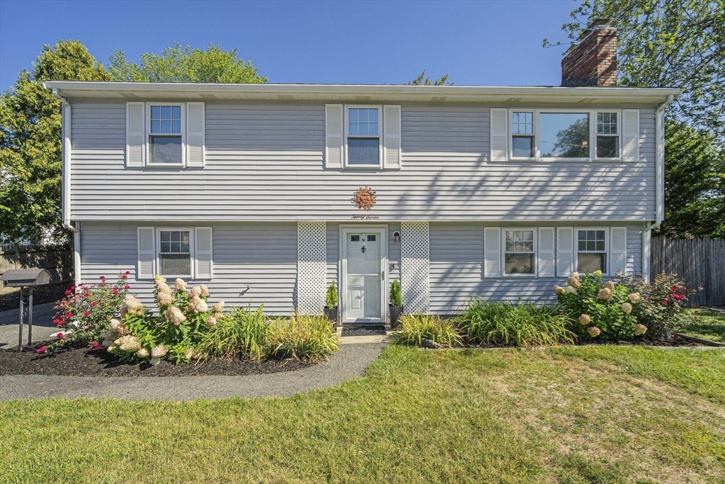 27 Plant Road Waltham, MA 02451 - Photo 1 of 31 front view of a house with a yard