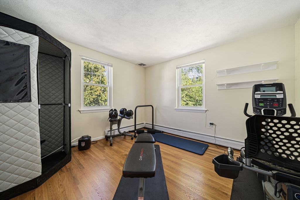 27 Plant Road Waltham, MA 02451 - Photo 11 of 31 a living room with furniture flat screen tv and window