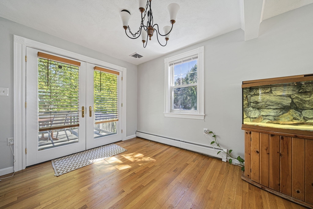 27 Plant Road Waltham, MA 02451 - Photo 13 of 31 a view of empty room with wooden floor and fan
