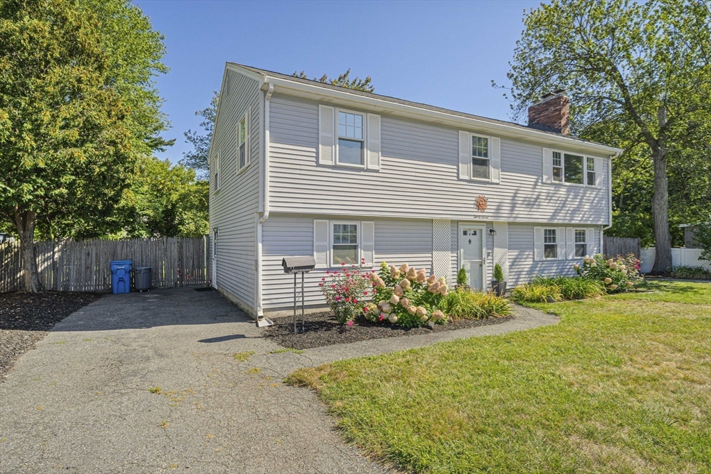 27 Plant Road Waltham, MA 02451 - Photo 2 of 31 front view of a house with a yard