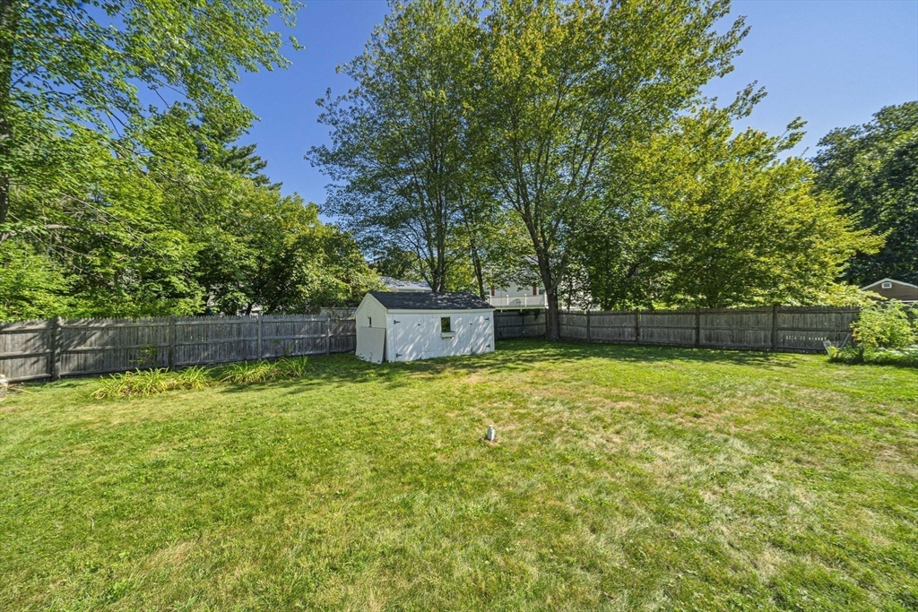 27 Plant Road Waltham, MA 02451 - Photo 23 of 31 a backyard of a house with lots of green space