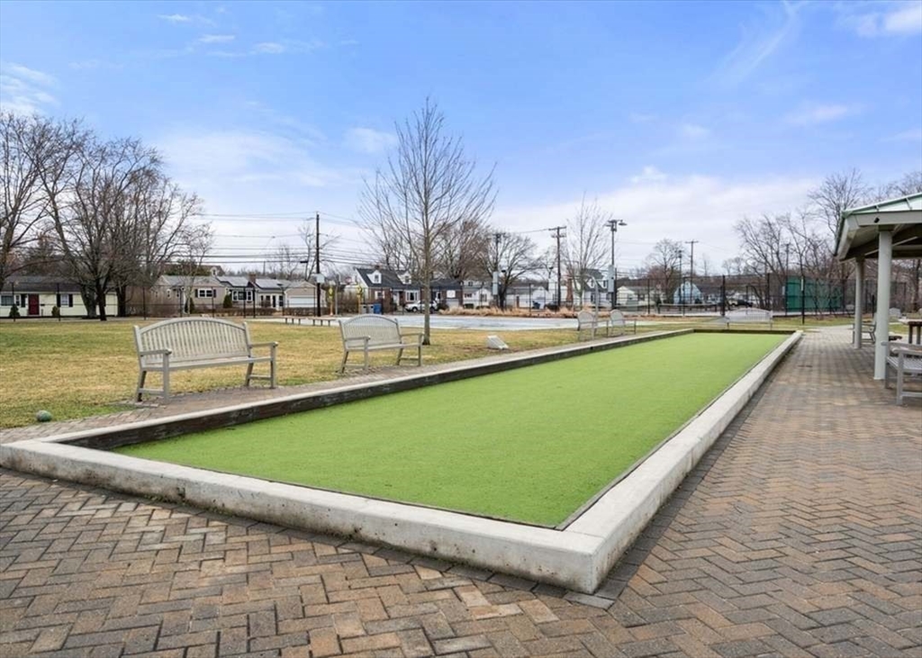 27 Plant Road Waltham, MA 02451 - Photo 28 of 31 a view of a swimming pool and a yard