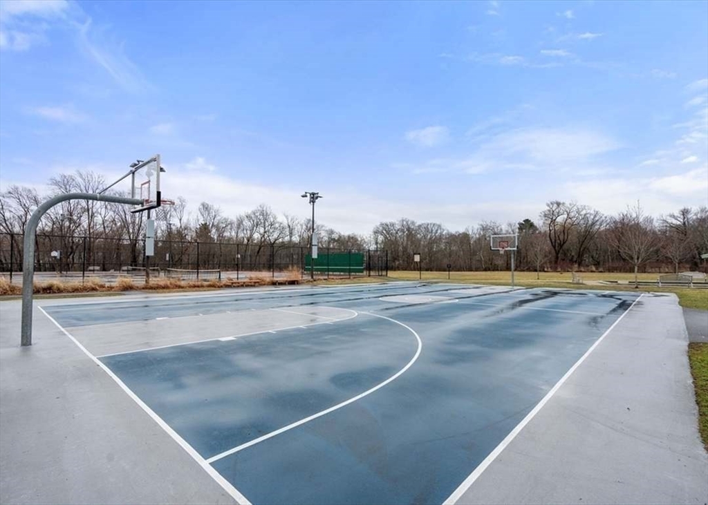27 Plant Road Waltham, MA 02451 - Photo 30 of 31 a view of yard with swimming pool outdoor seating and barbeque in the back
