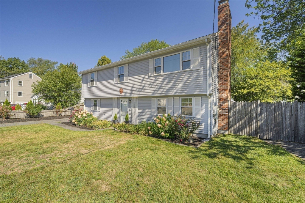 27 Plant Road Waltham, MA 02451 - Photo 3 of 31 a front view of house with yard and green space