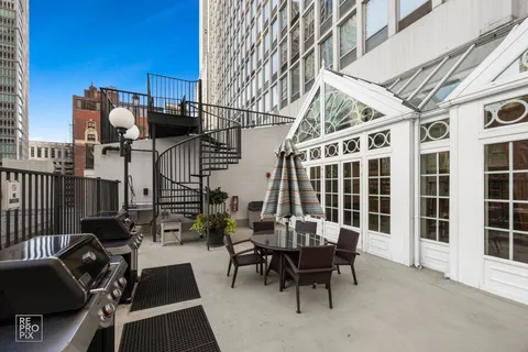 a view of a dinning tables and chairs in the balcony