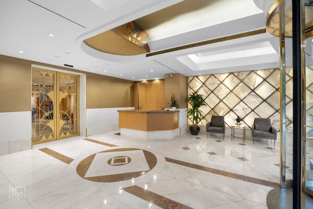 a bedroom with furniture and a large window