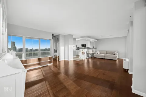 a view of a living room and hardwood floor