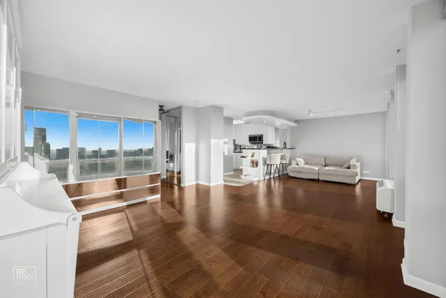 a view of a living room and hardwood floor