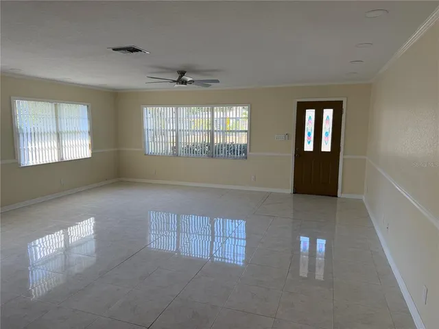 a view of an empty room with a window