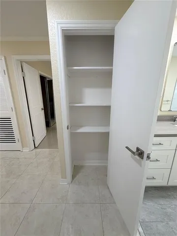 a view of an empty walk in closet