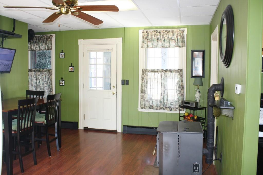 67 Pleasant Street Springvale, ME 04083 - Photo 8 of 35 Warm and inviting kitchen leads to...
