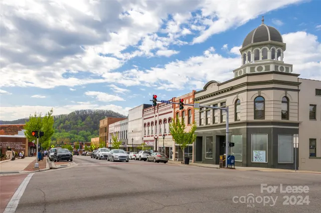 a view of a building with car parked