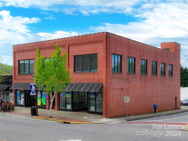 a view of a building with a street