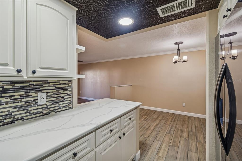 4937 Marine Parkway, Unit 105 New Port Richey, FL 34652 - Photo 12 of 50 a view of a storage and utility room with wooden floor