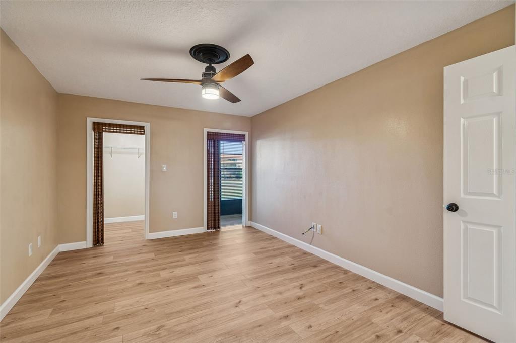 4937 Marine Parkway, Unit 105 New Port Richey, FL 34652 - Photo 20 of 50 a view of an empty room with wooden floor